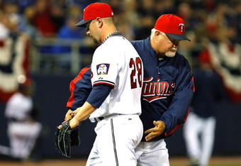 MINNEAPOLIS, MN - APRIL 6: Twins Manager Ron Gardenhire sends Jesse Crain #28 of the Minnesota Twins to the showers during a game against the Seattle Mariners at the Metrodome on April 6, 2009 in Minneapolis, Minnesota. (Photo by Scott A. Schneider/Getty Images)