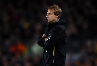 BARCELONA, SPAIN - APRIL 08:  Coach Juergen Klinsmann of Bayern Munich follows his players during the UEFA Champions League quarter final first leg match between FC Barcelona and FC Bayern Munich at the Camp Nou stadium on April 8, 2009 in Barcelona, Spain. Barcelona won the match 4-0.  (Photo by Jasper Juinen/Getty Images)