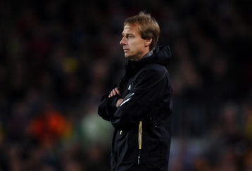 BARCELONA, SPAIN - APRIL 08:  Coach Juergen Klinsmann of Bayern Munich follows his players during the UEFA Champions League quarter final first leg match between FC Barcelona and FC Bayern Munich at the Camp Nou stadium on April 8, 2009 in Barcelona, Spain. Barcelona won the match 4-0.  (Photo by Jasper Juinen/Getty Images)