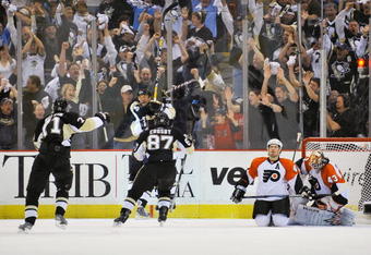 PITTSBURGH - APRIL 17:  Bill Guerin #13, Evgeni Malkin #71 and Sidney Crosby #87, all of the Pittsburgh Penguins, celebrate Guerin's overtime power play goal against the Philadelphia Flyers during Game Two of the Eastern Conference Quarterfinals of the 2009 Stanley Cup Playoffs on April 17, 2009 at Mellon Arena in Pittsburgh, Pennsylvania. Pittsburgh defeated Philadelphia 3-2 and takes a 2-0 lead in the series.  (Photo by Jamie Sabau/Getty Images)