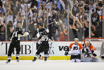 PITTSBURGH - APRIL 17:  Bill Guerin #13, Evgeni Malkin #71 and Sidney Crosby #87, all of the Pittsburgh Penguins, celebrate Guerin's overtime power play goal against the Philadelphia Flyers during Game Two of the Eastern Conference Quarterfinals of the 2009 Stanley Cup Playoffs on April 17, 2009 at Mellon Arena in Pittsburgh, Pennsylvania. Pittsburgh defeated Philadelphia 3-2 and takes a 2-0 lead in the series.  (Photo by Jamie Sabau/Getty Images)