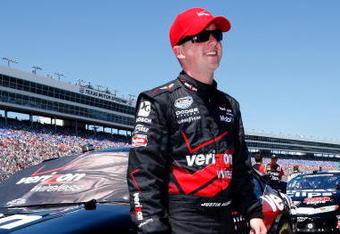 FORT WORTH, TX - APRIL 04:  Justin Allgaier, driver of the #12 Verizon FIOS Dodge, stands on the grid during the NASCAR Nationwide Series O'Reilly 300 at Texas Motor Speedway on April 4, 2009 in Fort Worth, Texas.  (Photo by John Harrelson/Getty Images)