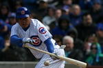 CHICAGO - APRIL 15:  Kosuke Fukudome of the Chicago Cubs attempts a bunt against the Colorado Rockies on April 15, 2009 at Wrigley Field in Chicago, Illinois. The Rockies defeated the Cubs 5-2. (Photo by Jonathan Daniel/Getty Images)