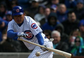 CHICAGO - APRIL 15:  Kosuke Fukudome of the Chicago Cubs attempts a bunt against the Colorado Rockies on April 15, 2009 at Wrigley Field in Chicago, Illinois. The Rockies defeated the Cubs 5-2. (Photo by Jonathan Daniel/Getty Images)