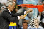 DETROIT - APRIL 06:  Head coach Roy Williams of the North Carolina Tar Heels cuts down a piece of the net after they 89-72 win against the Michigan State Spartans during the 2009 NCAA Division I Men's Basketball National Championship game at Ford Field on April 6, 2009 in Detroit, Michigan.  (Photo by Gregory Shamus/Getty Images)