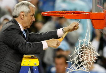 DETROIT - APRIL 06:  Head coach Roy Williams of the North Carolina Tar Heels cuts down a piece of the net after they 89-72 win against the Michigan State Spartans during the 2009 NCAA Division I Men's Basketball National Championship game at Ford Field on April 6, 2009 in Detroit, Michigan.  (Photo by Gregory Shamus/Getty Images)