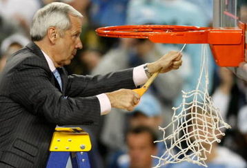 DETROIT - APRIL 06:  Head coach Roy Williams of the North Carolina Tar Heels cuts down a piece of the net after they 89-72 win against the Michigan State Spartans during the 2009 NCAA Division I Men's Basketball National Championship game at Ford Field on April 6, 2009 in Detroit, Michigan.  (Photo by Gregory Shamus/Getty Images)
