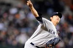 BALTIMORE - APRIL 8:  Chien-Ming Wang #40 of the New York Yankees pitches against the Baltimore Orioles at Camden Yards April 8, 2009 in Baltimore, Maryland.  (Photo by Greg Fiume/Getty Images)
