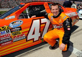 FORT WORTH, TX - APRIL 04:  Michael McDowell, driver of the #47 Tom's Snacks Toyota, kneels next to his car on the grid during the NASCAR Nationwide Series O'Reilly 300 at Texas Motor Speedway on April 4, 2009 in Fort Worth, Texas.  (Photo by Rusty Jarrett/Getty Images for NASCAR)