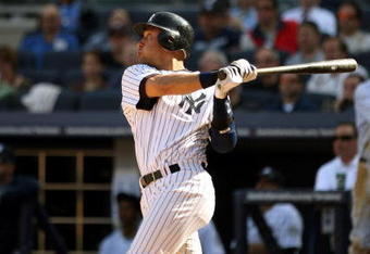 NEW YORK - APRIL 17:  Derek Jeter #2 of the New York Yankees hits a home run in the eighth inning of their game to give them a 6-5 lead over the Cleveland Indians at Yankee Stadium on April 17, 2009 in the Bronx borough of New York City.  (Photo by Ezra Shaw/Getty Images)