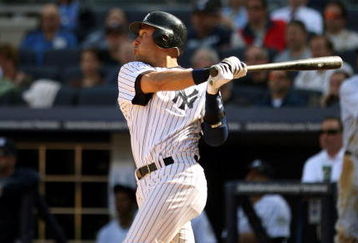 NEW YORK - APRIL 17:  Derek Jeter #2 of the New York Yankees hits a home run in the eighth inning of their game to give them a 6-5 lead over the Cleveland Indians at Yankee Stadium on April 17, 2009 in the Bronx borough of New York City.  (Photo by Ezra Shaw/Getty Images)