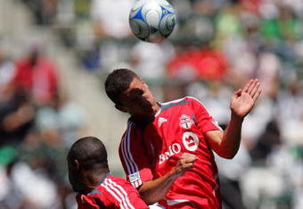 CARSON, CA - APRIL 13:  Marco Velez #4 of Toronto FC wins a header against Landon Donovan #10 of the Los Angeles Galaxy in the first half during their MLS game at the Home Depot Center on April 13, 2008 in Carson, California. Toronto FC defeated the Galaxy 3-2.  (Photo by Victor Decolongon/Getty Images)