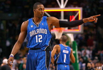 BOSTON, MA - MARCH 8:  Dwight Howard #12 of the Orlando Magic reacts in the final moments of a game against the Boston Celtics at the TD Banknorth Garden on March 8, 2009 in Boston, Massachusetts. The Celtics lost 86-79. NOTE TO USER: User expressly acknowledges and agrees that, by downloading and/or using this Photograph, user is consenting to the terms and conditions of the Getty Images License Agreement. (Photo by Jim Rogash/Getty Images)