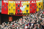 LIVERPOOL, ENGLAND - APRIL 15:  Liverpool supporters in the Kop attend the the Hillsborough memorial service at Anfield on April 15, 2009, Liverpool, England. Thousands of fans, friends and relatives descended on Liverpool's Anfield Stadium to mark the 20th anniversary of the Hillsborough disaster. A total of 96 Liverpool supporters lost their lives during a crush at an FA Cup semi final against Nottingham Forest at the Hillsborough football ground in Sheffield, South Yorkshire in 1989. (Photo by Jim Dyson/Getty Images)