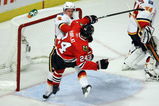 CHICAGO - APRIL 18:  Dion Phaneuf #3 of the Calgary Flames checks Martin Havlat #24 of the Chicago Blackhawks off of his skates during the first period of Game Two of the Western Conference Quarterfinals of the 2009 Stanley Cup Playoffs on April 18, 2009 at the United Center in Chicago, Illinois.  (Photo by Jonathan Daniel/Getty Images)