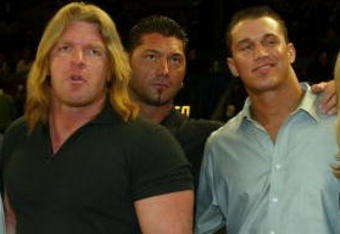 NEW YORK - MARCH 9:  WWE wrestlers (L-R) Ric Flair, Triple H, Batista, Randy Orton, Stacy Kiebler & Miss Jackie attend the New York Knicks v Boston Celtics  NBA game March 9, 2004 at Madison Square Garden in New York City.   (Photo by Ray Amati/Getty Images)