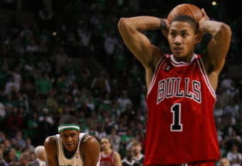 BOSTON - APRIL 18:  Rajon Rondo #9 of the Boston Celtics looks on as Derrick Rose #1 of the Chicago Bulls prepares to shoot a free throw in the final minute of overtime in Game One of the Eastern Conference Quarterfinals during the 2009 NBA Playoffs at TD Banknorth Garden on April 18, 2009 in Boston, Massachusetts. Rondo was called for fouling Rose. The Chicago Bulls defeated the Boston Celtics 105-103 in overtime. NOTE TO USER: User expressly acknowledges and agrees that, by downloading and or using this photograph, User is consenting to the terms and conditions of the Getty Images License Agreement. (Photo by Elsa/Getty Images)