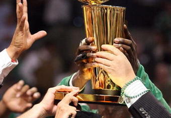 BOSTON - JUNE 17:  The Boston Celtics celebrate with the Larry O'Brien Trophy after defeating the Los Angeles Lakers in Game Five of the 2008 NBA Finals on June 17, 2008 at TD Banknorth Garden in Boston, Massachusetts. NOTE TO USER: User expressly acknowledges and agrees that, by downloading and/or using this Photograph, user is consenting to the terms and conditions of the Getty Images License Agreement.  (Photo by Elsa/Getty Images)