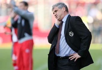 COTTBUS, GERMANY - APRIL 26:  Coach Bojan Prasnikar of Cottbus looks on during the Bundesliga match between FC Energie Cottbus and FC Hansa Rostock at the Stadion der Freundschaft on April 26, 2008 in Cottbus, Germany. (Photo by Matthias Kern/Bongarts/Getty Images)