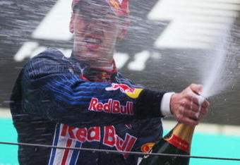 SHANGHAI, CHINA - APRIL 19:  Sebastian Vettel of Germany and Red Bull Racing celebrates on the podium after winning the Chinese Formula One Grand Prix at the Shanghai International Circuit on April 19, 2009 in Shanghai, China.  (Photo by Mark Thompson/Getty Images)