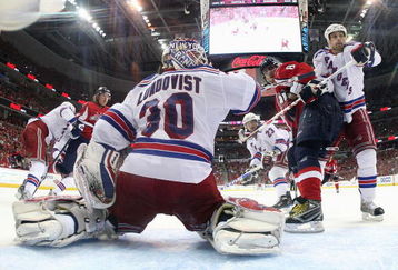 WASHINGTON - APRIL 18: Henrik Lundqvist #30 of the New York Rangers makes the save as Alex Ovechkin #8 of the Washington Capitals looks for a rebound during Game Two of the Eastern Conference Quarterfinal Round of the 2009 NHL Stanley Cup Playoffs at Verizon Center on April 18, 2009 in Washington, DC. Dan Girardi #5 of the Rangers also helps out. The Rangers defeated the Capitals 1-0. (Photo by Bruce Bennett/Getty Images)