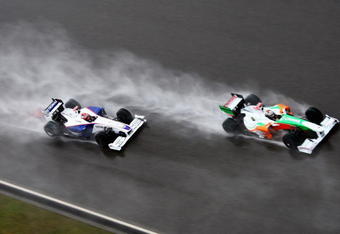 SHANGHAI, CHINA - APRIL 19:  Adrian Sutil (R) of Germany and Force India and Robert Kubica (L) of Poland and BMW Sauber drive during the Chinese Formula One Grand Prix at the Shanghai International Circuit on April 19, 2009 in Shanghai, China.  (Photo by Clive Mason/Getty Images)