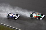 SHANGHAI, CHINA - APRIL 19:  Adrian Sutil (R) of Germany and Force India and Robert Kubica (L) of Poland and BMW Sauber drive during the Chinese Formula One Grand Prix at the Shanghai International Circuit on April 19, 2009 in Shanghai, China.  (Photo by Clive Mason/Getty Images)