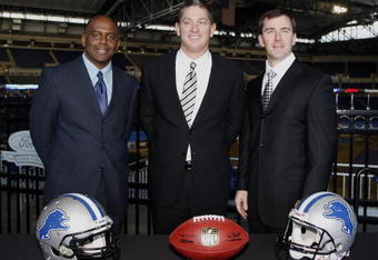 DETROIT , MI - JANUARY 16:  Jim Schwartz, center, head coach of the Detroit Lions poses with General Manager Martin Mayhew, left, and Tom Lewand team president after a press conference to introduce him as the Lions new head coach on January 16, 2009 at Ford Field in Detroit, Michigan.  (Photo by Gregory Shamus/Getty Images)