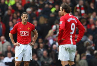 MANCHESTER, UNITED KINGDOM - MARCH 14:  Dimitar Berbatov and Rio Ferdinand of Manchester United look on dejectedly after their team conceded a fourth goal during the Barclays Premier League match between Manchester United and Liverpool at Old Trafford on March 14, 2009 in Manchester, England.  (Photo by Laurence Griffiths/Getty Images)