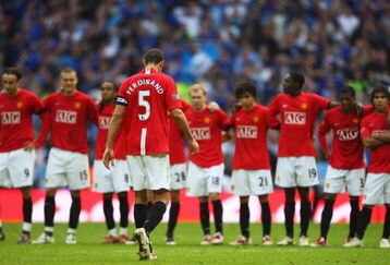 LONDON, ENGLAND - APRIL 19:  Rio Ferdinand of Manchester United walks back to his team mates following his miss in the penalty shoot out during the FA Cup sponsored by E.ON Semi Final match between Everton and Manchester United at Wembley Stadium on April 19, 2009 in London, England.  (Photo by Jamie McDonald/Getty Images)