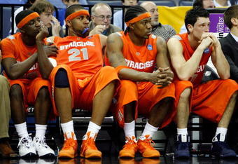 MEMPHIS, TN - MARCH 27:  (L-R) Jonny Flynn #10, Arinze Onuaku #21, Paul Harris #11 and Andy Rautins #1 of the Syracuse Orange sit on the bench late in the second half before losing to the Oklahoma Sooners during the NCAA Men's Basketball Tournament South Regionals at the FedExForum on March 27, 2009 in Memphis, Tennessee. The Sooners defeated the Orange 84-71.  (Photo by Joe Murphy/Getty Images)