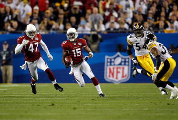 TAMPA, FL - FEBRUARY 01:  Steve Breaston #15 of the Arizona Cardinals returns a punt against the Pittsburgh Steelers during Super Bowl XLIII on February 1, 2009 at Raymond James Stadium in Tampa, Florida. Steelers won 27-23. (Photo by Chris Graythen/Getty Images)