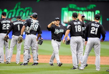 WASHINGTON - APRIL 19:  Cody Ross #12 of the Florida Marlins celebrates with teammates after a 7-4 victory against the Washington Nationals at Nationals Park on April 19, 2009 in Washington, DC.  (Photo by Greg Fiume/Getty Images)