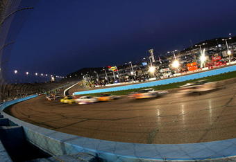 AVONDALE, AZ - APRIL 18: A general view of cars racing during the NASCAR Sprint Cup Series SUBWAY Fresh Fit 500 at Phoenix International Raceway on April 18, 2009 in Avondale, AZ.  (Photo by Todd Warshaw/Getty Images)