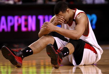 PORTLAND, OR - APRIL 18:  Brandon Roy #7 of the Portland Trail Blazers holds his face after being injured during a scramble for the ball against  the Houston Rockets during Game One of the Western Conference Quarterfinals of the 2009 NBA Playoffs on April 18, 2009 at the Rose Garden in Portland, Oregon. NOTE TO USER: User expressly acknowledges and agrees that, by downloading and or using this Photograph, user is consenting to the terms and conditions of the Getty Images License Agreement.  (Photo by Jonathan Ferrey/Getty Images)