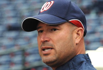 ATLANTA - APRIL 11:  Manager Manny Acta #14 of  the Washington Nationals watches batting practice before play against the Atlanta Braves on April 11, 2009 at Turner Field in Atlanta, Georgia.  (Photo by Al Messerschmidt/Getty Images) 