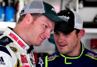 CONCORD, NC - SEPTEMBER 23:  Dale Earnhardt Jr., driver of the #88 National Guard AMP Chevrolet, speaks with Casey Mears, driver of the #5 Kelloggs Chevrolet, during NASCAR Sprint Cup testing at Lowes Motor Speedway on September 23, 2008 in Concord, North Carolina.  (Photo by Rusty Jarrett/Getty Images)