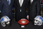 DETROIT , MI - JANUARY 16:  Jim Schwartz, center, head coach of the Detroit Lions poses with General Manager Martin Mayhew, left, and Tom Lewand team president after a press conference to introduce him as the Lions new head coach on January 16, 2009 at Ford Field in Detroit, Michigan.  (Photo by Gregory Shamus/Getty Images)