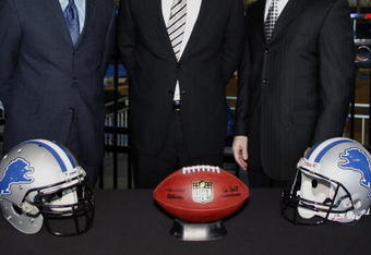 DETROIT , MI - JANUARY 16:  Jim Schwartz, center, head coach of the Detroit Lions poses with General Manager Martin Mayhew, left, and Tom Lewand team president after a press conference to introduce him as the Lions new head coach on January 16, 2009 at Ford Field in Detroit, Michigan.  (Photo by Gregory Shamus/Getty Images)