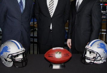 DETROIT , MI - JANUARY 16:  Jim Schwartz, center, head coach of the Detroit Lions poses with General Manager Martin Mayhew, left, and Tom Lewand team president after a press conference to introduce him as the Lions new head coach on January 16, 2009 at Ford Field in Detroit, Michigan.  (Photo by Gregory Shamus/Getty Images)
