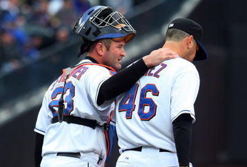 NEW YORK - APRIL 04:  Brian Schneider #23 of the New York Mets talks with teammate Oliver Perez #46 during the first inning against the Boston Red Sox on April 4, 2009 at Citi Field in the Flushing neighborhood of the Queens borough of New York City.  (Photo by Jim McIsaac/Getty Images)