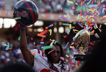 DALLAS - JANUARY 02:  Dexter McCluster #22 of the Mississippi Rebels celebrates a 47-34 win against the Texas Tech Red Raiders during the AT&T Cotton Bowl on January 2, 2009 at the Cotton Bowl in Dallas, Texas.  (Photo by Ronald Martinez/Getty Images)