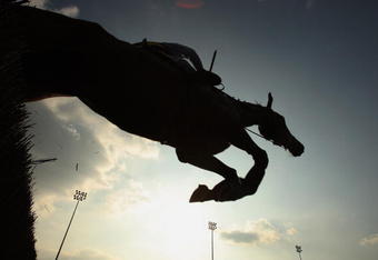 SUNBURY-ON-THAMES, UNITED KINGDOM - APRIL 20:  The Play Poker@williamhill.com Novices' Steeple Chase is raced at Kempton Park Racecourse on April 20, 2009 in Sudbury-On-Thames, England.  (Photo by Warren Little/Getty Images)