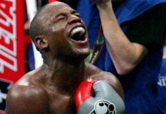 LAS VEGAS - DECEMBER 08:  Floyd Mayweather Jr. celebrates his 10th round knockout of Ricky Hatton after their WBC world welterweight championship fight at the MGM Grand Garden Arena on December 8, 2007 in Las Vegas, Nevada.  (Photo by Ethan Miller/Getty Images)