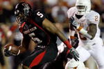 LUBBOCK, TX - NOVEMBER 01:  Michael Crabtree #5 of the Texas Tech Red Raiders carries the ball after making a reception during the first half of the game against the Texas Longhorns on November 1, 2008 at Jones Stadium in Lubbock, Texas.  (Photo by Jamie Squire/Getty Images)