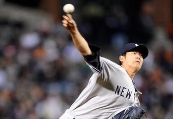 BALTIMORE - APRIL 8:  Chien-Ming Wang #40 of the New York Yankees pitches against the Baltimore Orioles at Camden Yards April 8, 2009 in Baltimore, Maryland.  (Photo by Greg Fiume/Getty Images)