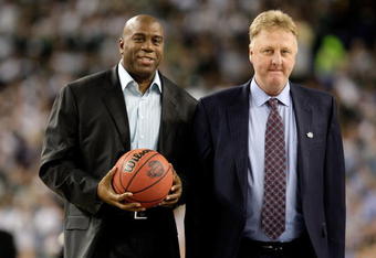 DETROIT - APRIL 06:  Larry Bird (R) and Earvin 'Magic' Johnson walk on the court to be honored for the 30th anniversary of their match up in 1979 NCAA Championship Game between Indiana State and Michigan State prior to the Michigan State Spartans playing against the North Carolina Tar Heels during the 2009 NCAA Division I Men's Basketball National Championship game at Ford Field on April 6, 2009 in Detroit, Michigan.  (Photo by Andy Lyons/Getty Images)