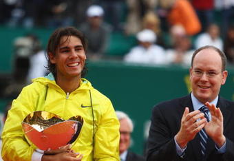 MONTE CARLO, MONACO - APRIL 19:  Rafael Nadal (l) of Spain holds the winners trophy alongside Prince Albert II of Monaco (r) after his 6-3,2-6,6-1 victory in the final match against Novak Djokovic of Serbia during day seven of the ATP Masters Series at the Monte Carlo Country Club on April 19, 2009 in Monte Carlo,Monaco.  (Photo by Michael Steele/Getty Images)