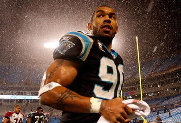 CHARLOTTE, NC - JANUARY 10:  Julius Peppers #89 of the Carolina Panthers walks off the field in the rain after being defeated by the Arizona Cardinals 33-13 in the NFC Divisional Playoff Game on January 10, 2009 at Bank of America Stadium in Charlotte, North Carolina.  (Photo by Streeter Lecka/Getty Images)