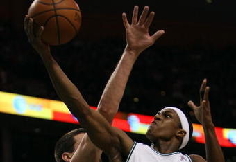 BOSTON - APRIL 20:  Rajon Rondo #9 of the Boston Celtics is fouled by Brad Miller #52 of the Chicago Bulls in Game Two of the Eastern Conference Quarterfinals during the 2009 NBA Playoffs at TD Banknorth Garden on April 20, 2009 in Boston, Massachusetts.  NOTE TO USER: User expressly acknowledges and agrees that, by downloading and or using this photograph, User is consenting to the terms and conditions of the Getty Images License Agreement. (Photo by Elsa/Getty Images)